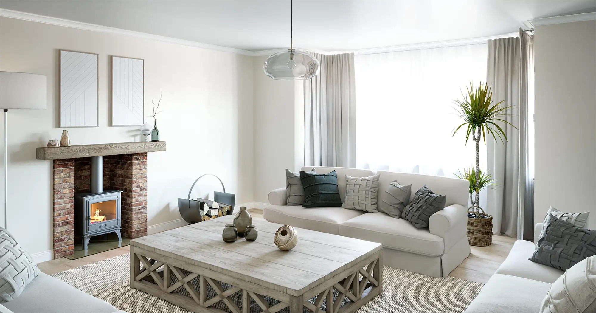 Modern Living Room Interior CGI with Fireplace and Neutral Design Photorealistic living room interior CGI featuring a white sofa, wooden coffee table, brick fireplace with wood‑burning stove, and large window with sheer curtains filling the space with daylight.