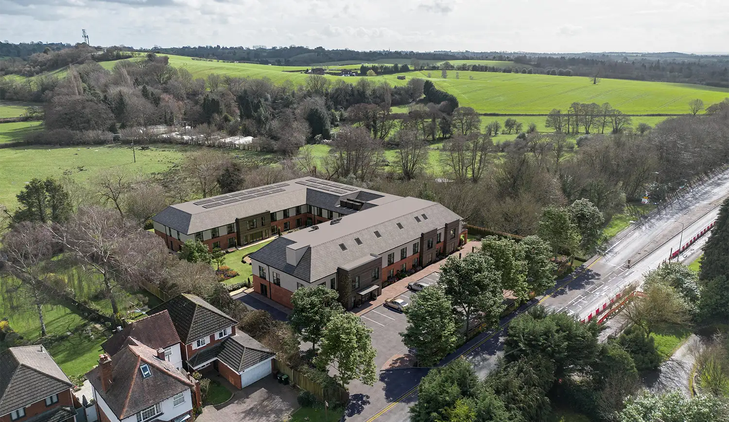 CGI Photomontage | Visualtrick of care home Aerial CGI photomontage of a proposed building complex integrated into real drone photography for planning and marketing use.